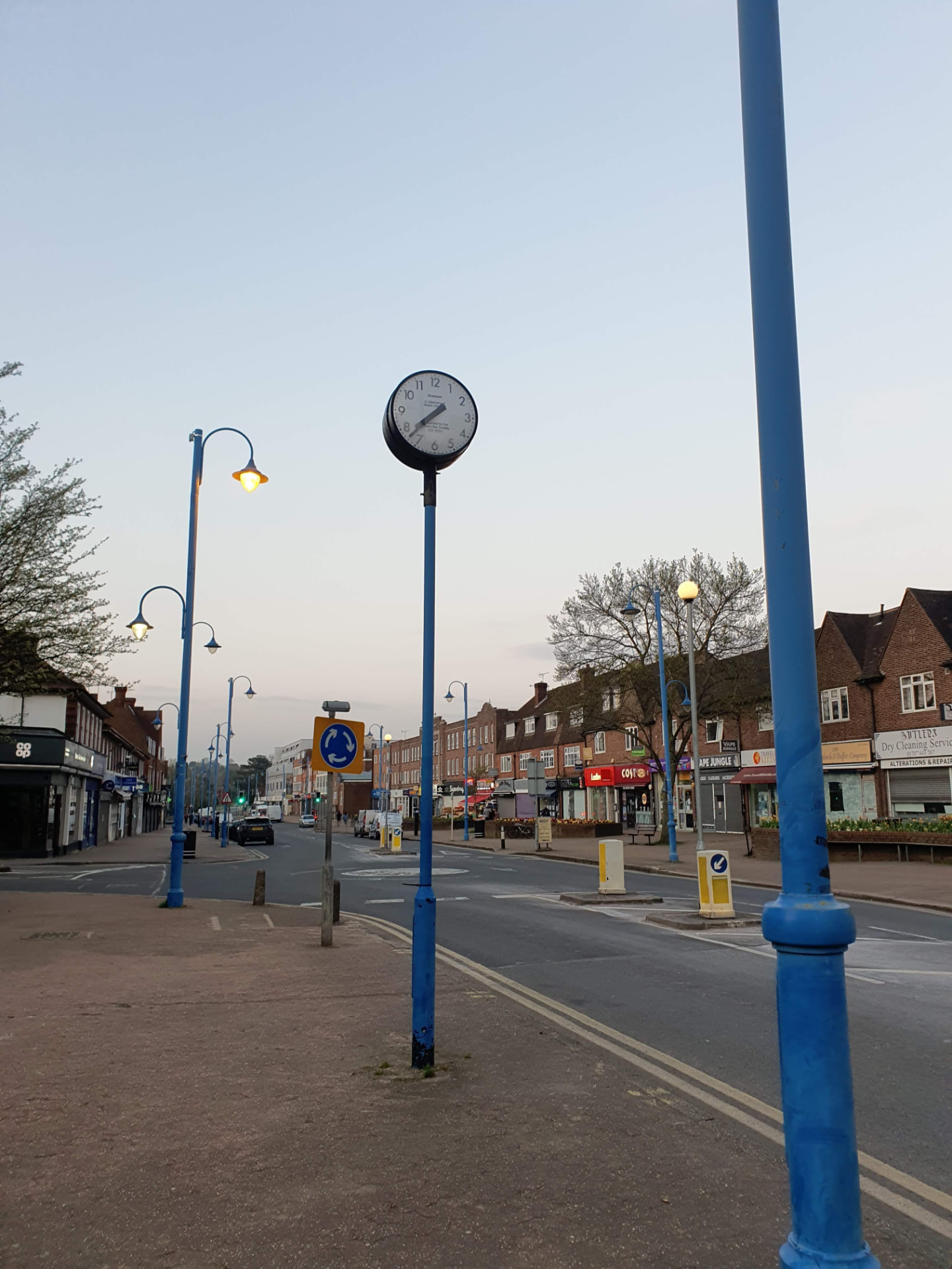 The high street clock and local shops in Potters Bar
